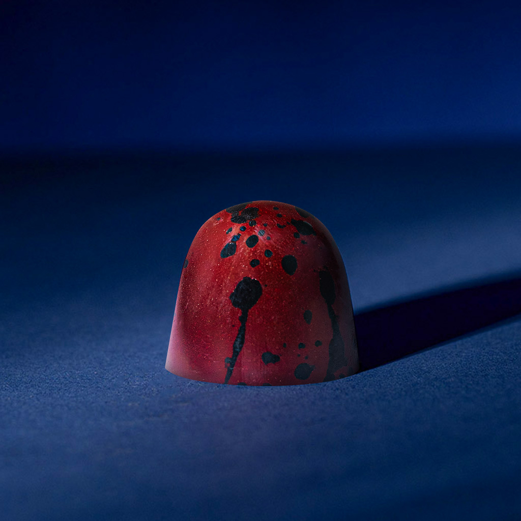 kategoria Praliny  i Makaroniki, produkt na obrazku to Pralina soczysta malina - 4 szt